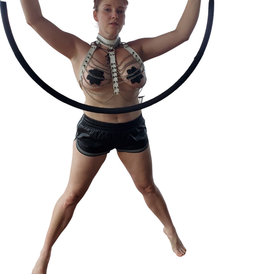 Aerial Hoop model wearing Leather and Chain Three Column Halter Harness and black/grey Prowler Leather Sports Shorts