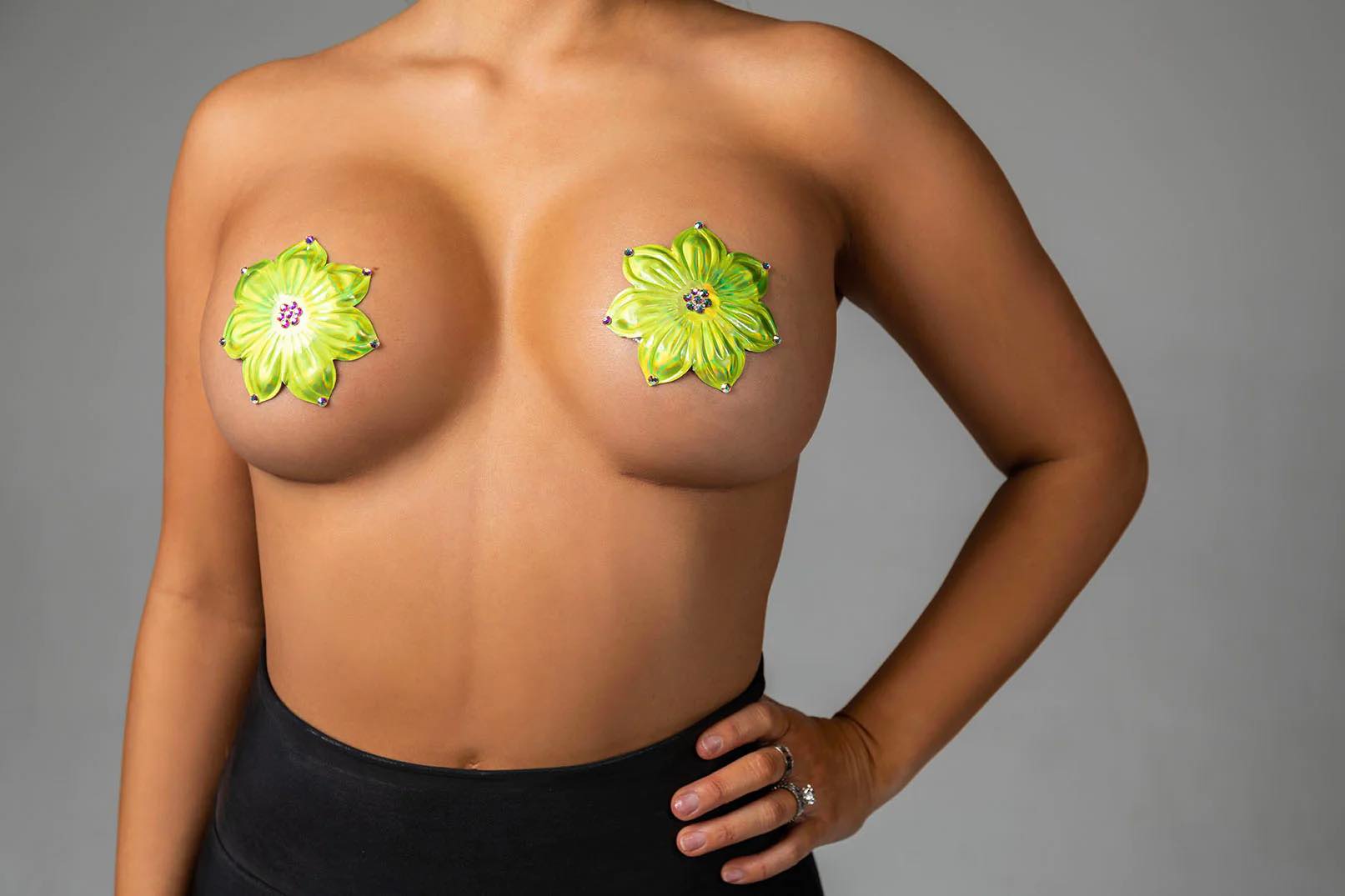 A model wearing the neon green Miami Deluxe Reusable Pasties by Blissidy.