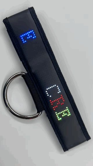 A gif of the words "Create your own message scrolling along the Marquee Programmable LED Center Strap 2.0.