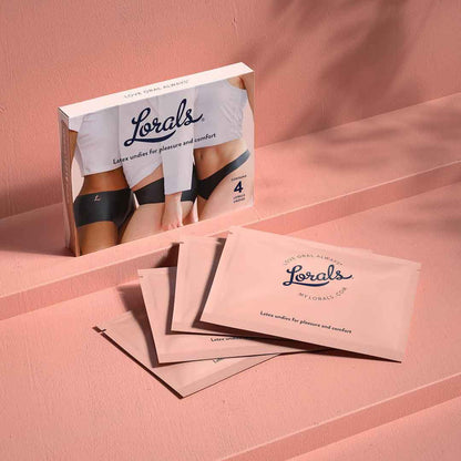 4 individually wrapped Lorals Panties For Pleasure and Comfort next to its packaging.