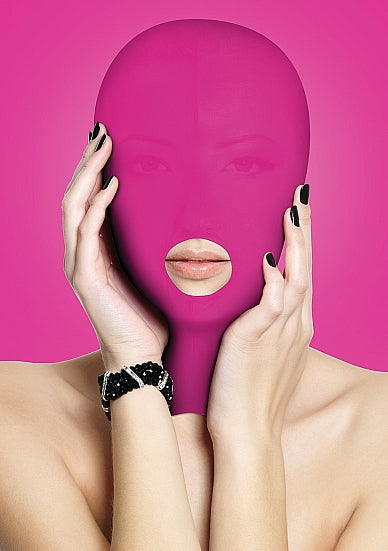 A model wearing the pink Submission Mask.