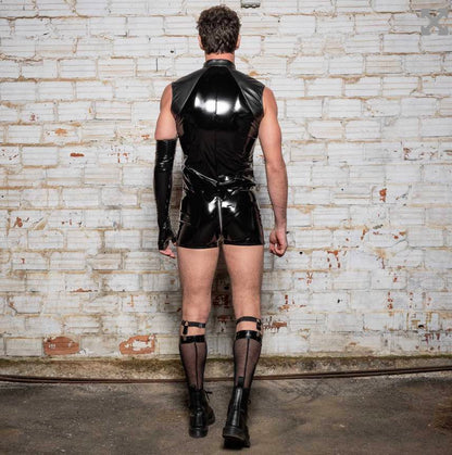 A model wearing the Anders Wetlook & Patent Playsuit with socks, garter and combat boots, rear view.