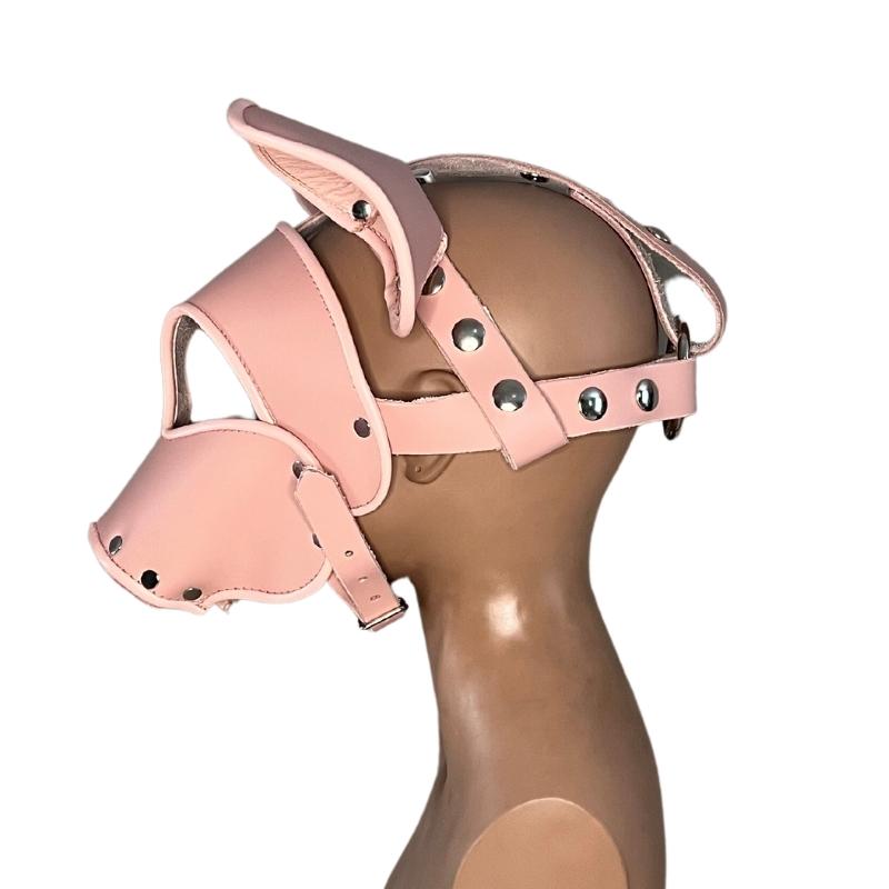 left side of pink short snout pig mask on mannequin head