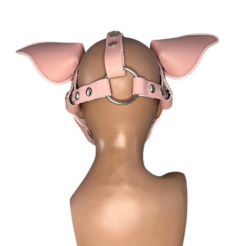 back of pink short snout pig mask on mannequin