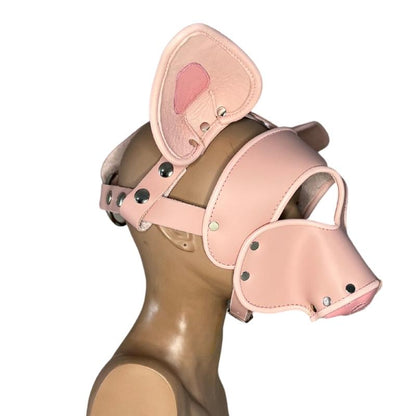 right side of pink short snout pig mask on mannequin