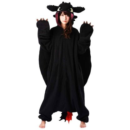 Model wearing Toothless Dragon with both hands up by shoulders.