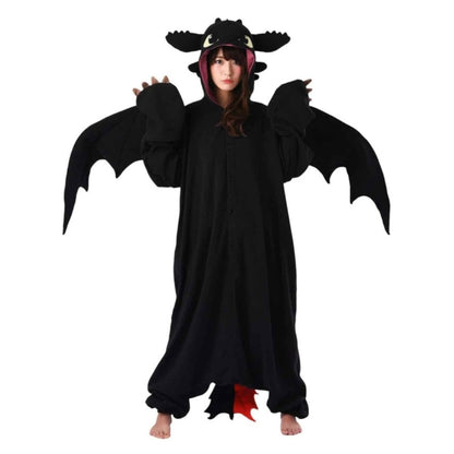 Model wearing Toothless Dragon with hands up and wings extended.