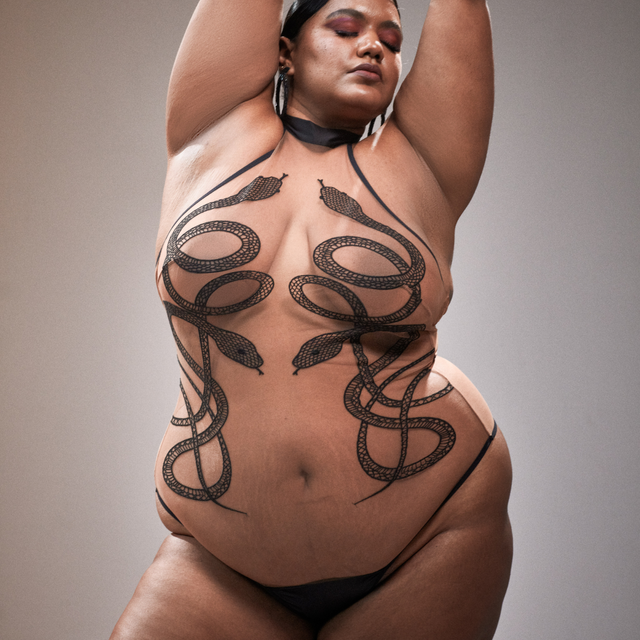 Toffee Medusa Bodysuit with black snakes on full figured model front view