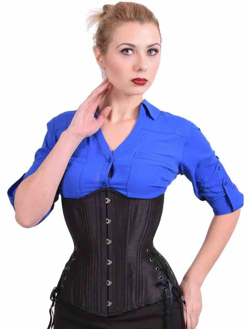 A model wearing the Black Taffeta Longline Underbust Corset in Hourglass Silhouette over a blue shirt, front view.