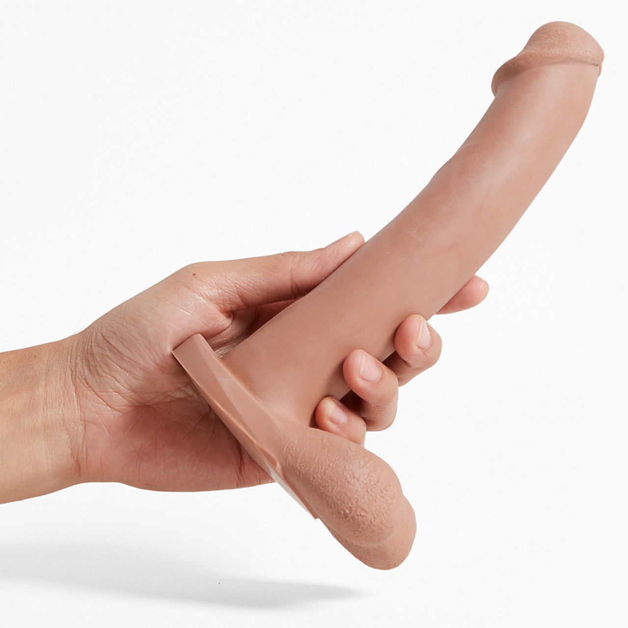 A hand holding the light Admiral Dual Density Dildo.