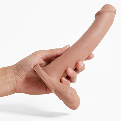 A hand holding the light Admiral Dual Density Dildo.