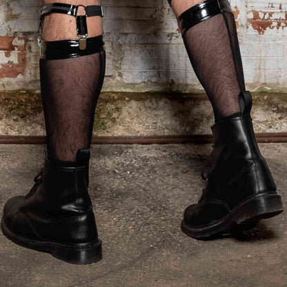 A model's legs wearing the Ali Fishnet Socks with Ali sock garters and combat boots, rear view.