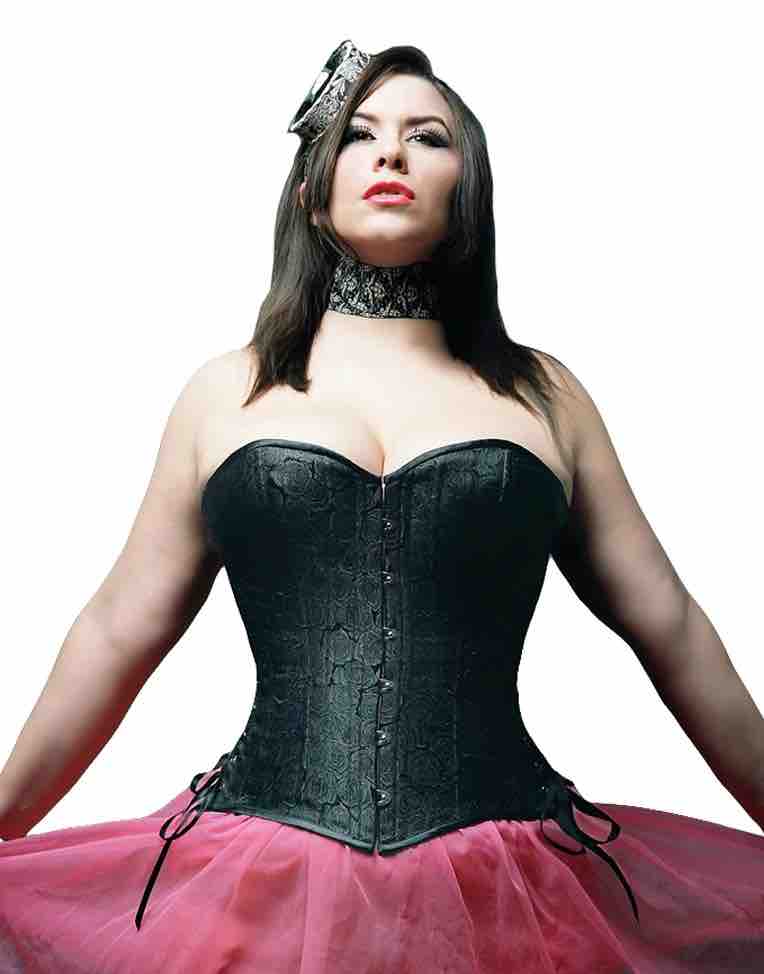 A model wearing the Black Rose Brocade Short Overbust Corset in Slim Silhouette over a pink skirt.