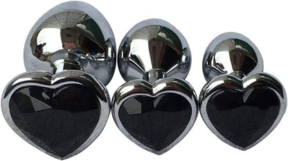 Three Steel Heart Jewel Anal Plugs of different sizes with black heart jewels.