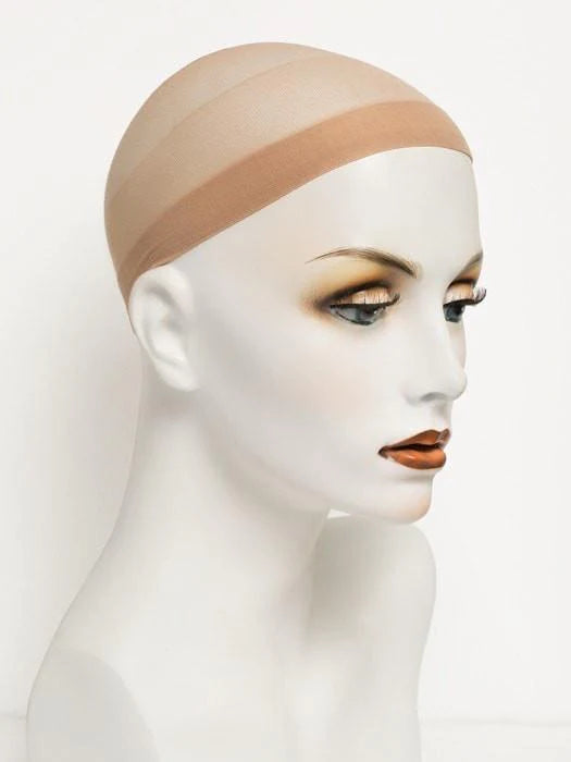 The beigw Wig Cap on a mannequin head.