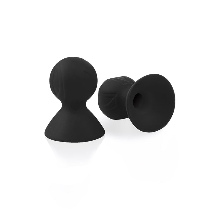 The black Silicone Nipple Suckers, one standing upright, the other laying on its side.