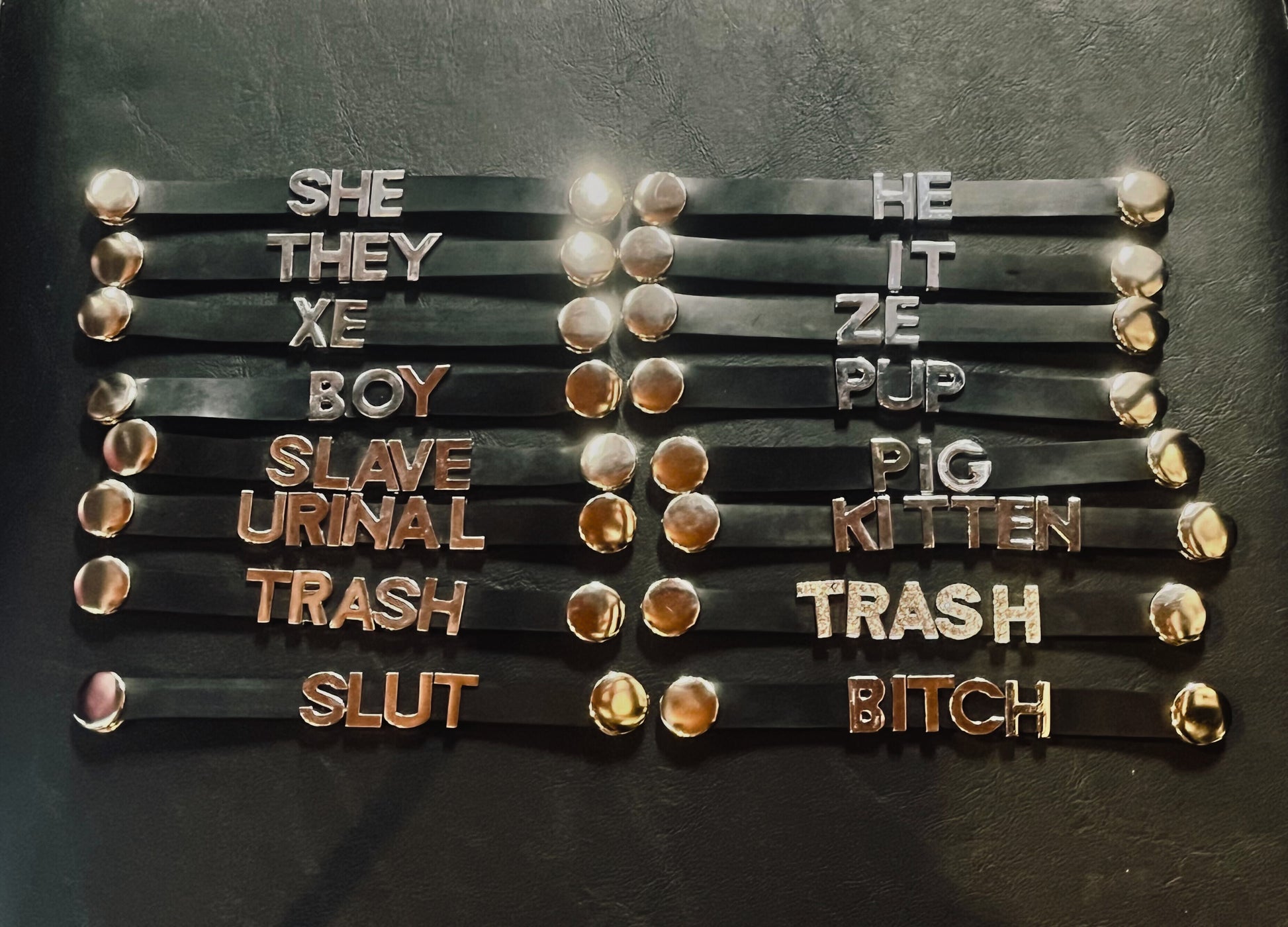 Several Heavy Rubber Word Name Tags arranged together.