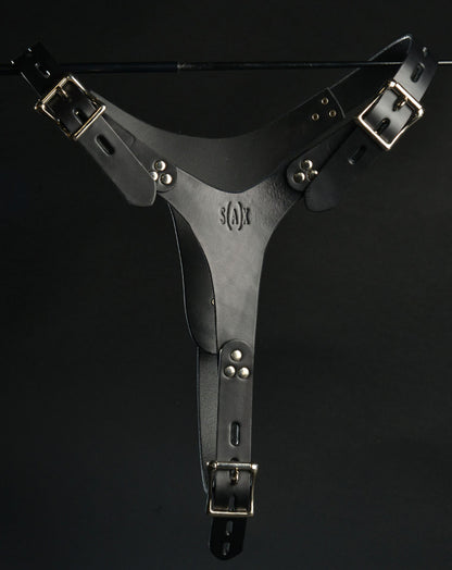 Adjustable Leather Vaginal Chastity Belt hanging on a metal rod, rear view.