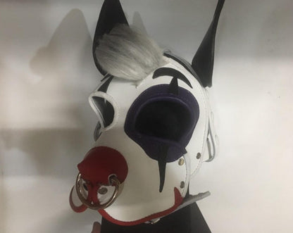 The Harlequin Hound Leather Pup Mask with Hair on a mannequin head, front view.