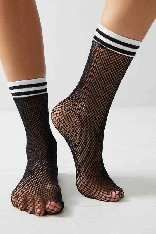 A model wearing the Athletic Fishnet Ankle Socks.