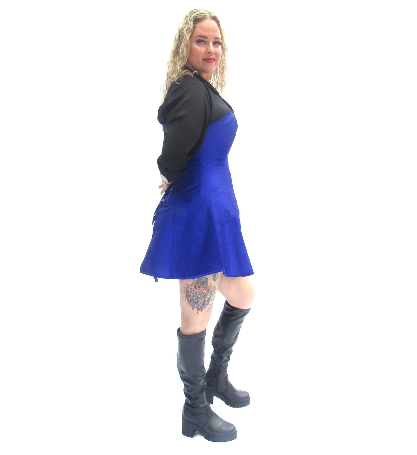 A model wearing the Indigo Silk Skirted Overbust Corset, side view.