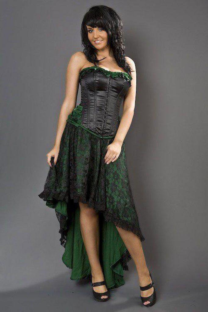 A model wears the black and green Lace Elizium Skirt with a black and green corset.