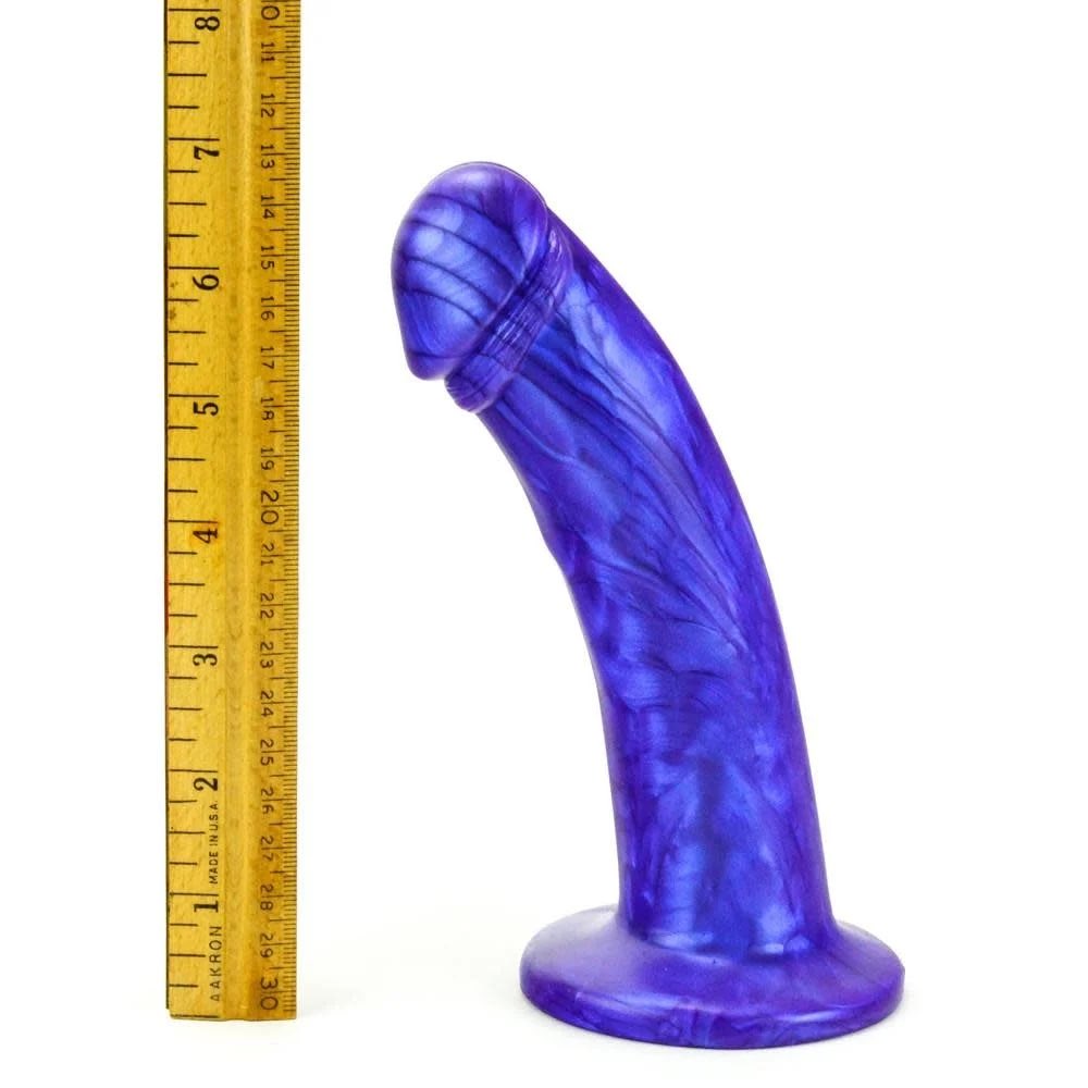 The purple Leo Suction Cup Dildo next to a ruler showing that it is about 7" tall.