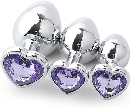 Three Steel Heart Jewel Anal Plugs of different sizes with lavender heart jewels.