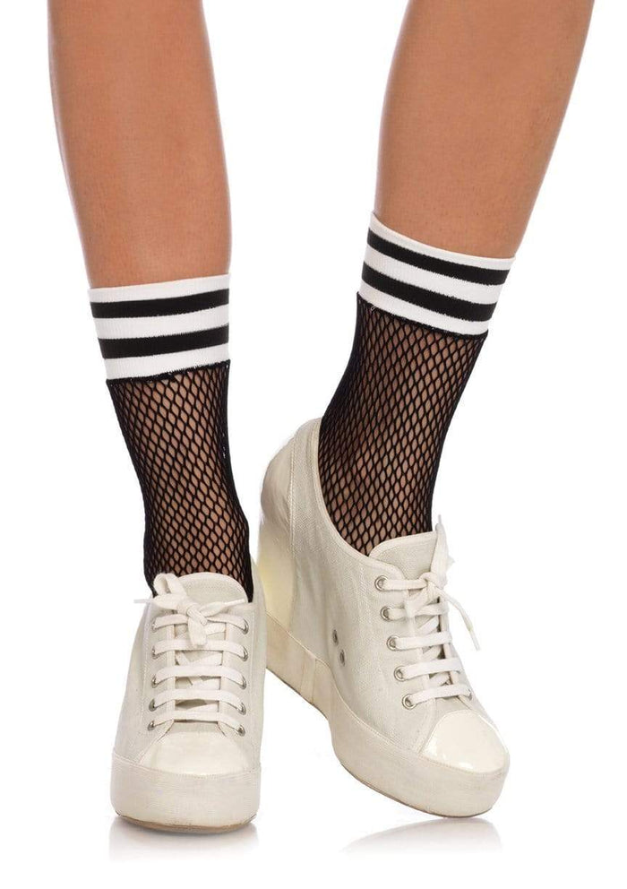 A model wearing the Athletic Fishnet Ankle Socks with white sneaker heels.
