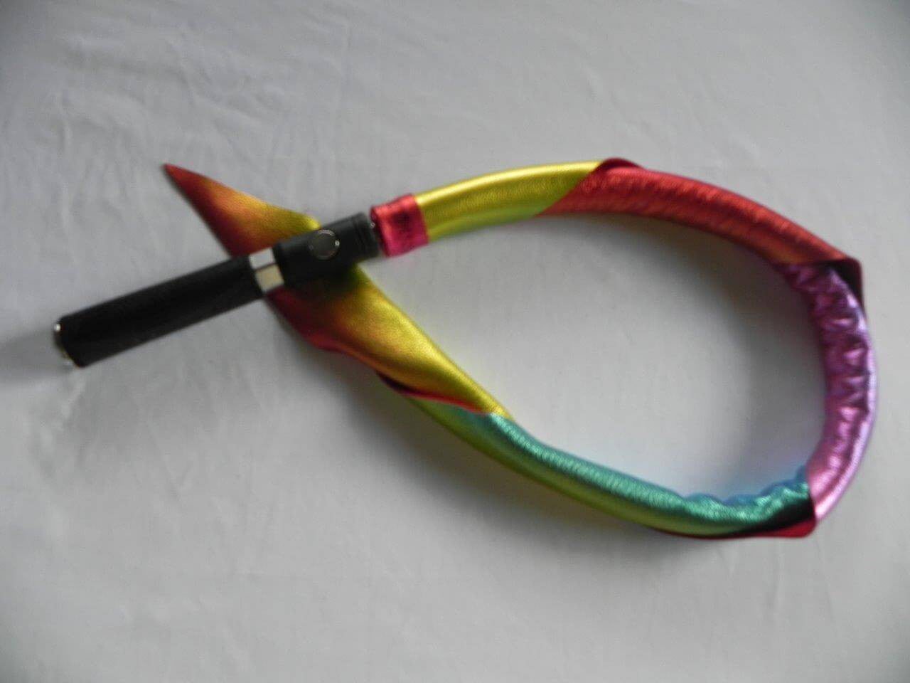 The metallic rainbow Unique Kink Dragon Tail Head with handle attached.