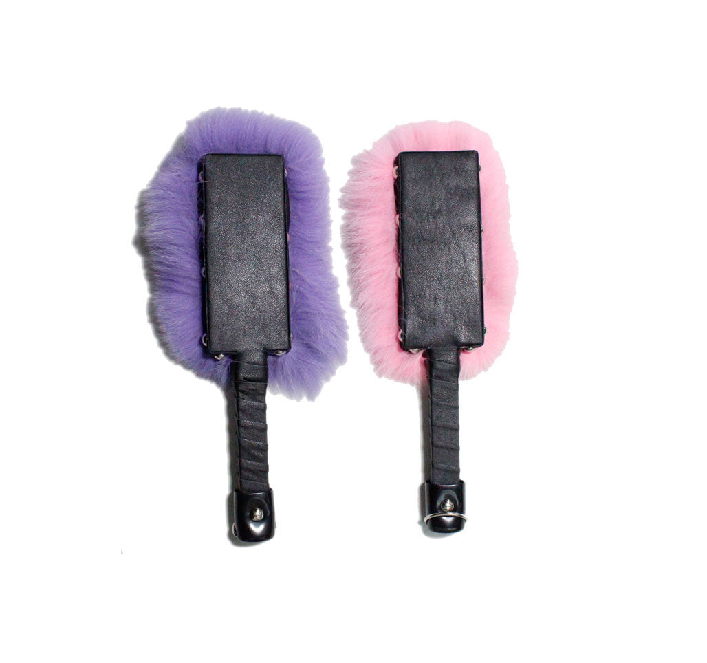The leather paddle side of the purple and the baby pink Fox Fur and Leather Paddle.