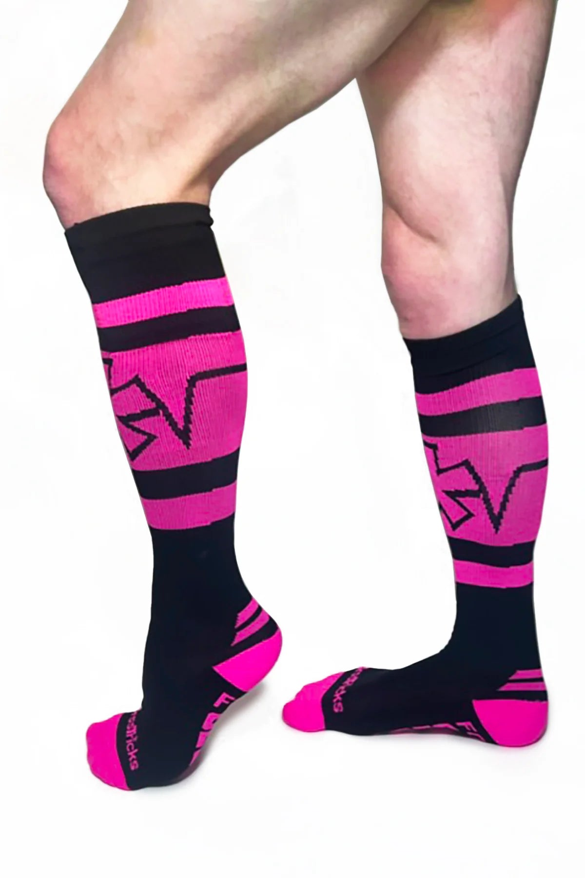 Pocket sock in neon pink on male model side view