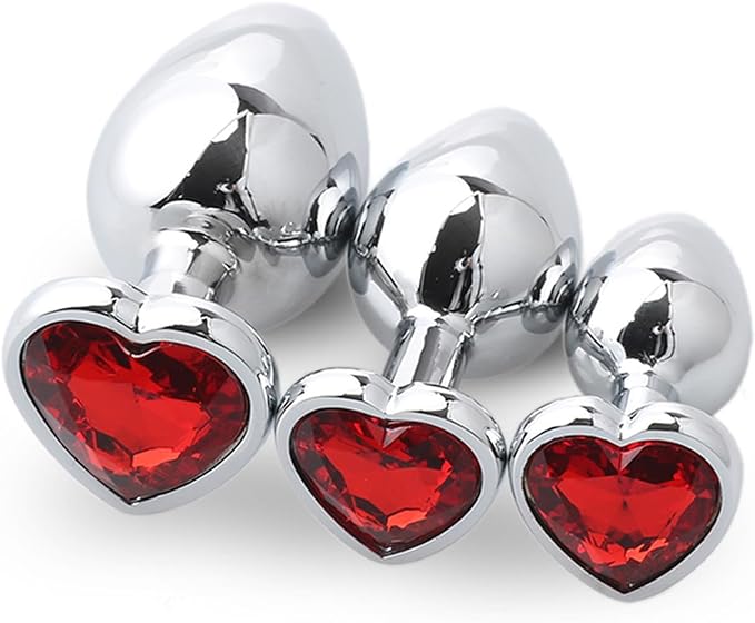 Three Steel Heart Jewel Anal Plugs of different sizes with red heart jewels.