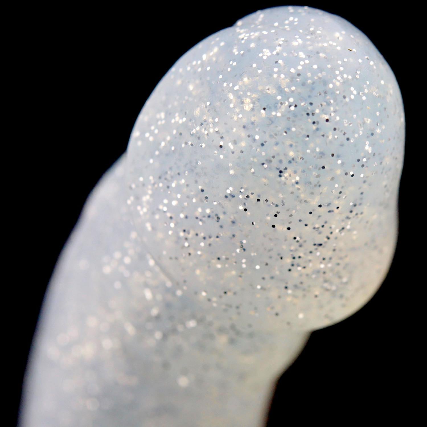 A close up of the head of the silver glitter Woody Silicone Dildo.