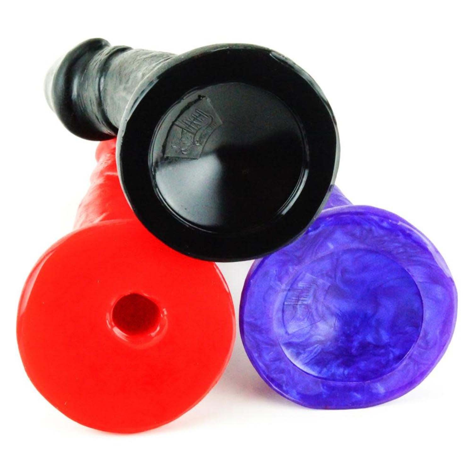 The bottoms of the black, purple and red Woody Silicone Dildos. 
