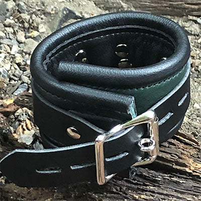 Hunter green rolled leather deluxe cuffs, back buckle closure.