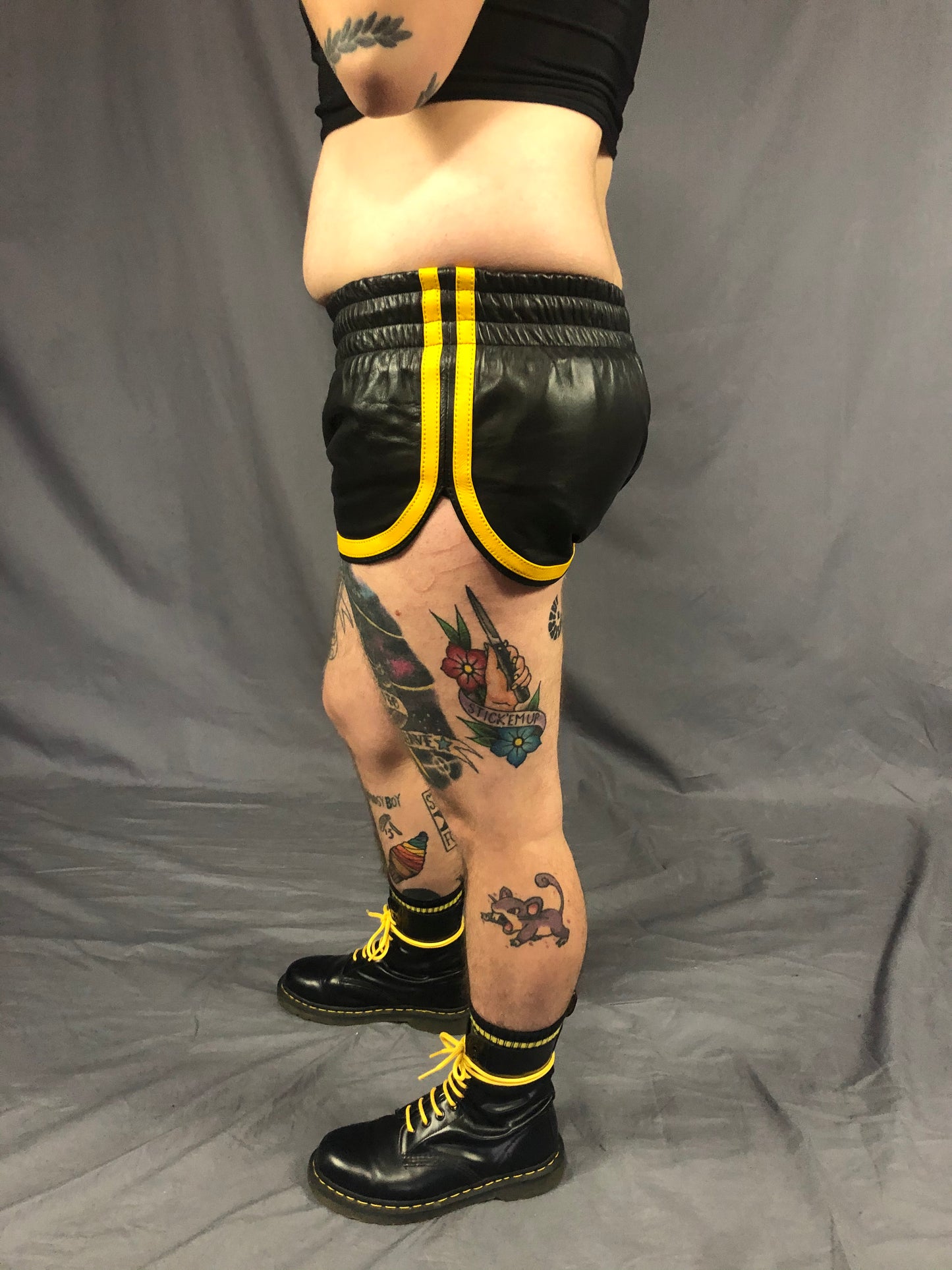 Close up of left side of the black and yellow prowler leather sport shorts.