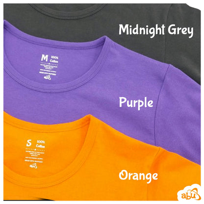 Midnight grey, purple, and orange diapersuits layed out flat on top of one another