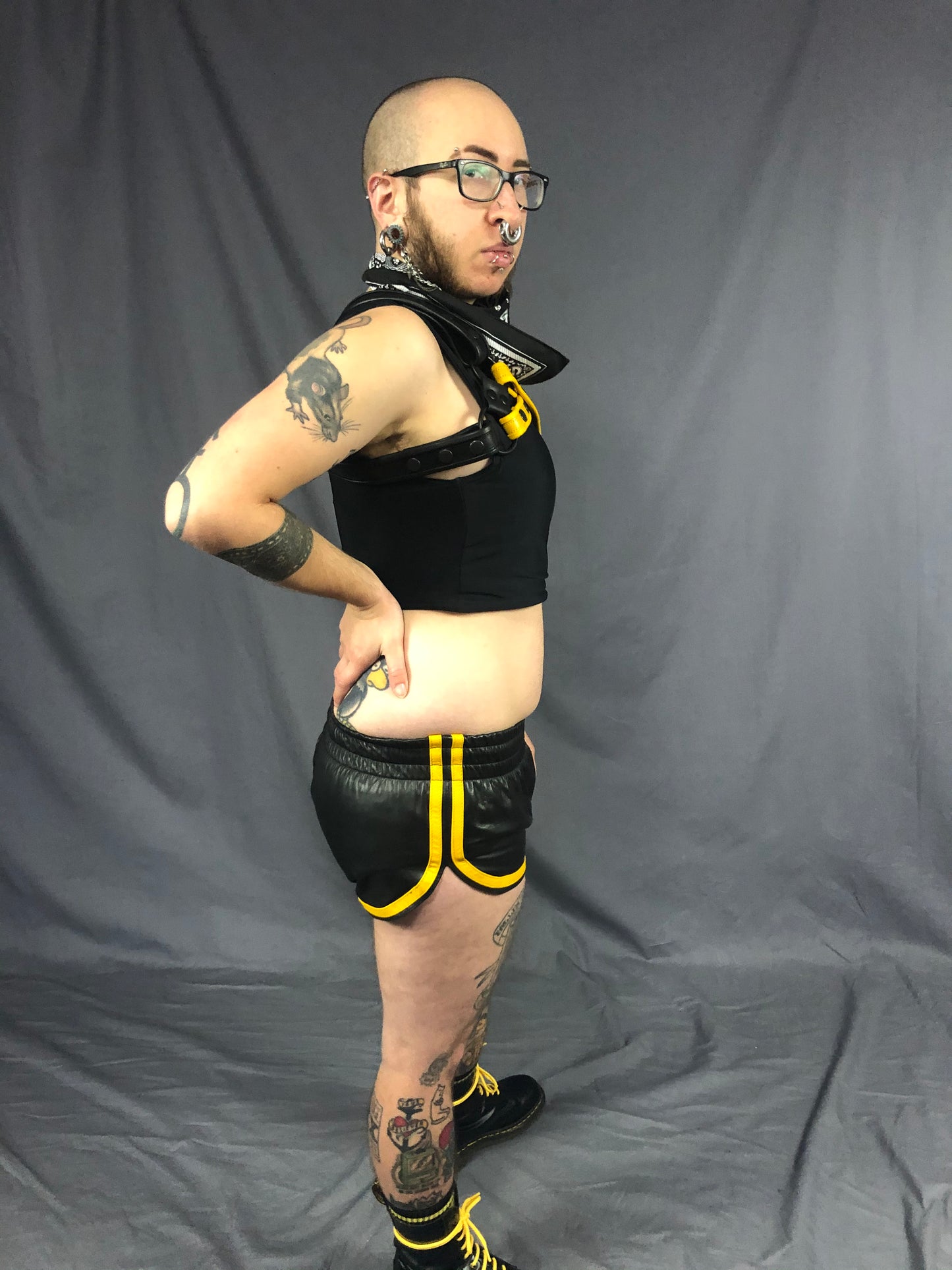 Right side view of the black and yellow prowler leather sport shorts.