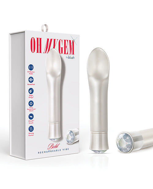 The Oh My Gem Bold Diamond Vibrator standing upright next to its packaging and another Oh My Gem Bold Diamond Vibrator lying on its side exposing the diamond decoration on its end.
