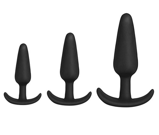The black small, medium and large trainer plugs.