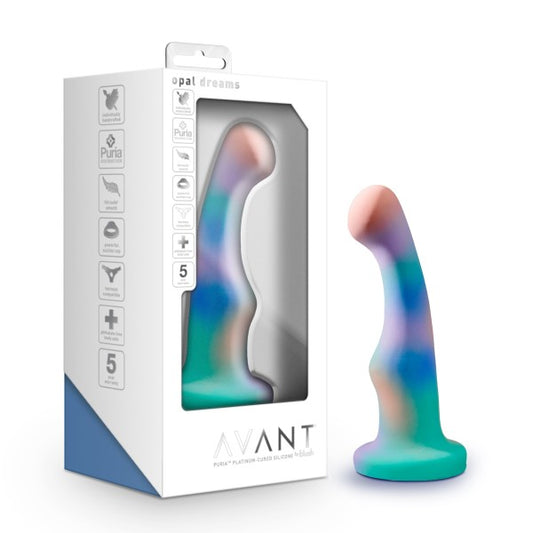 The unicorn Avant Opal Dreams Dildo standing upright on its suction cup next to its packaging.