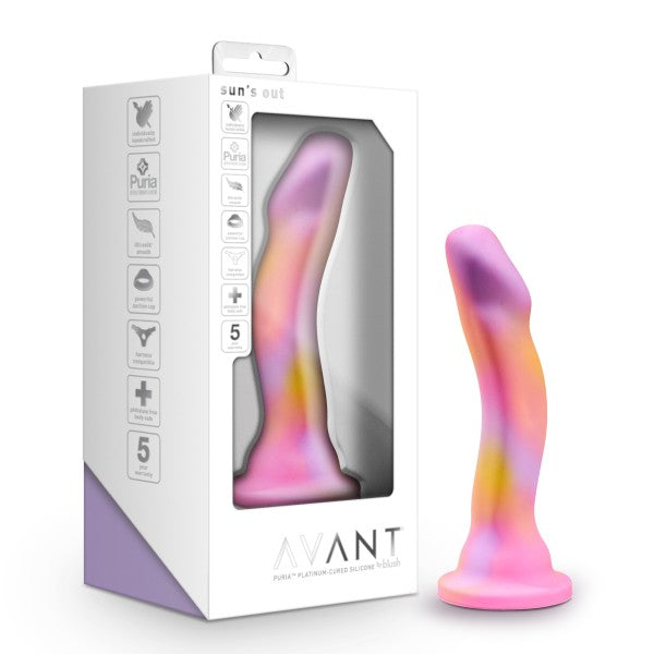 The Avant Suns Out Pink Dildo standing on its suction cup next to its packaging.