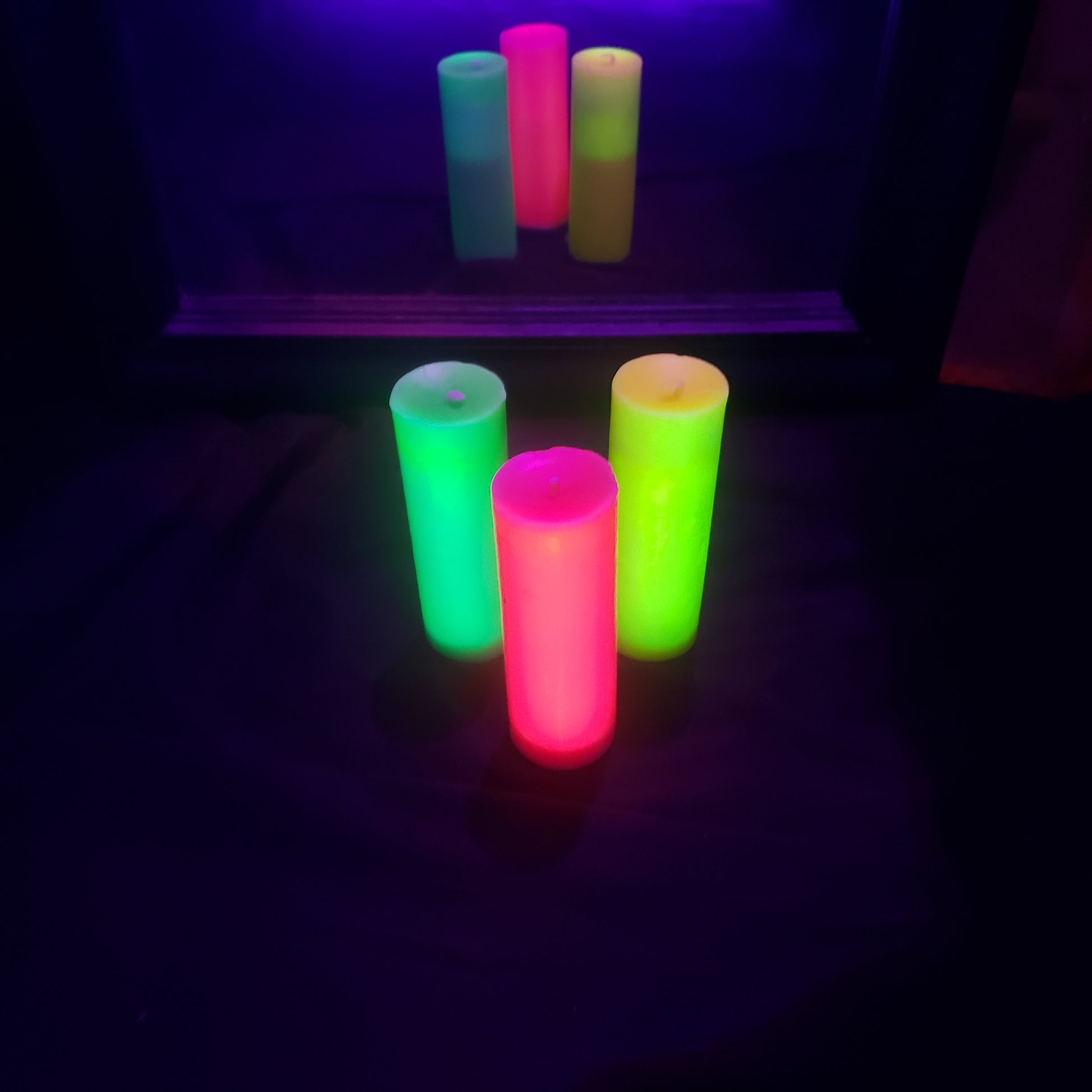 Three Neon Unscented Paraffin Play Pillar Candles.