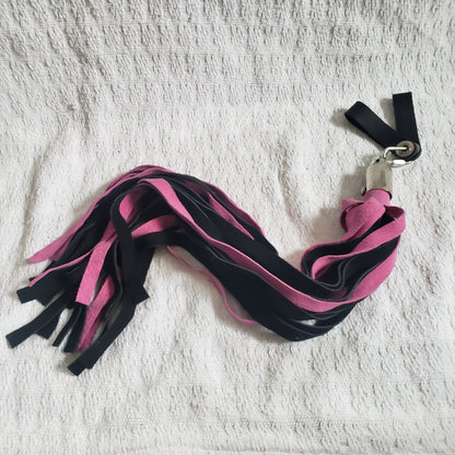 The pink and black suede finger loop flogger.