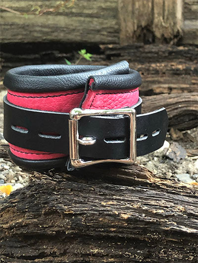 Pink rolled leather deluxe cuff, back buckle closure.