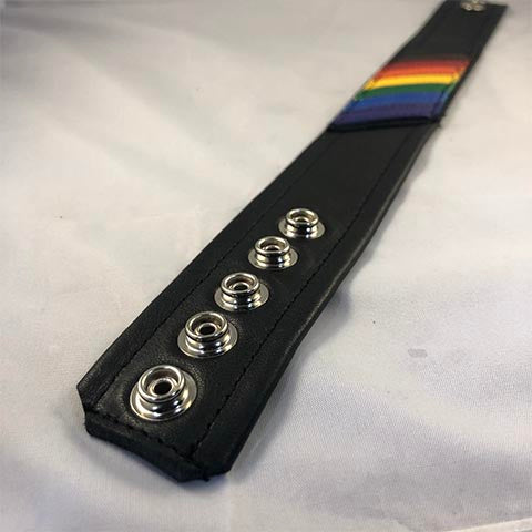 Close up of snaps of Pride flag leather armband 