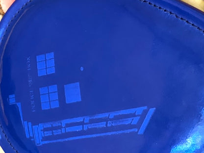 Close up of phone booth on blue vinyl Dr. Who paddle.