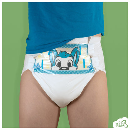 Front view of diaper on model with blue husky character printed on front.