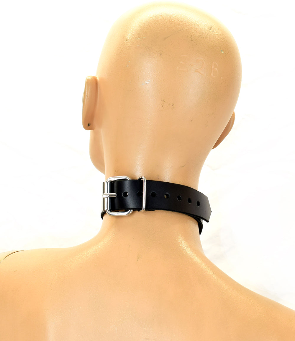 Rear view of the metal band formal collar around neck of a mannequin.
